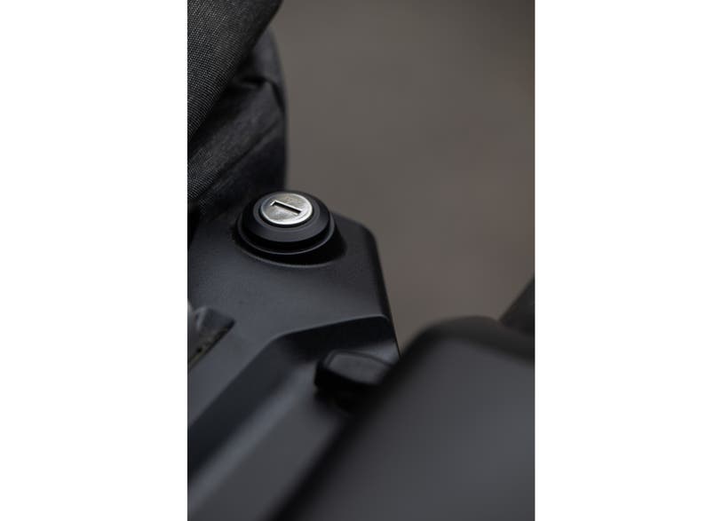Can-Am Origin LinQ saddlebag mounting latch closeup on EV motorcycle