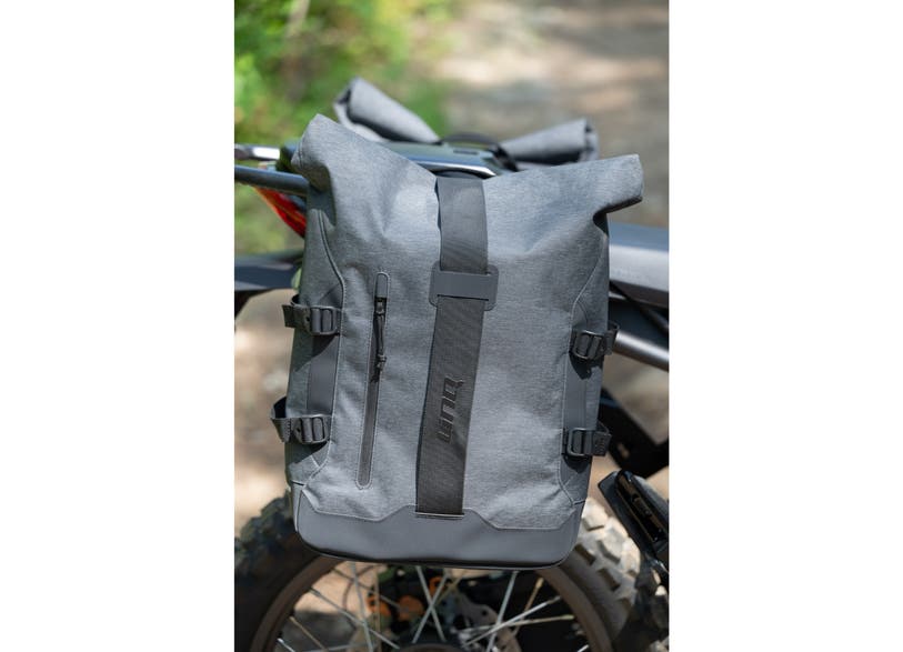 Can-Am Pulse LinQ saddlebag 22L roll-top gray bag mounted on EV motorcycle rear rack
