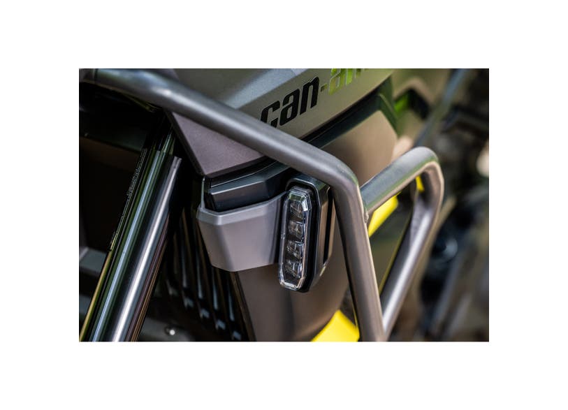 Can-Am Origin LED fog light mounted on front bumper brush guard, close-up view