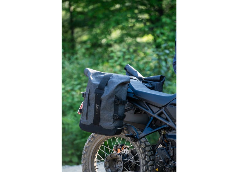 Can-Am Origin LinQ 22L saddlebag mounted on rear rack of adventure motorcycle