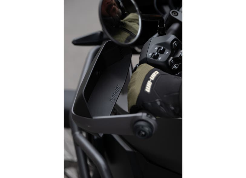 Can-Am Origin Pulse handguard deflectors closeup on EV motorcycle handlebar
