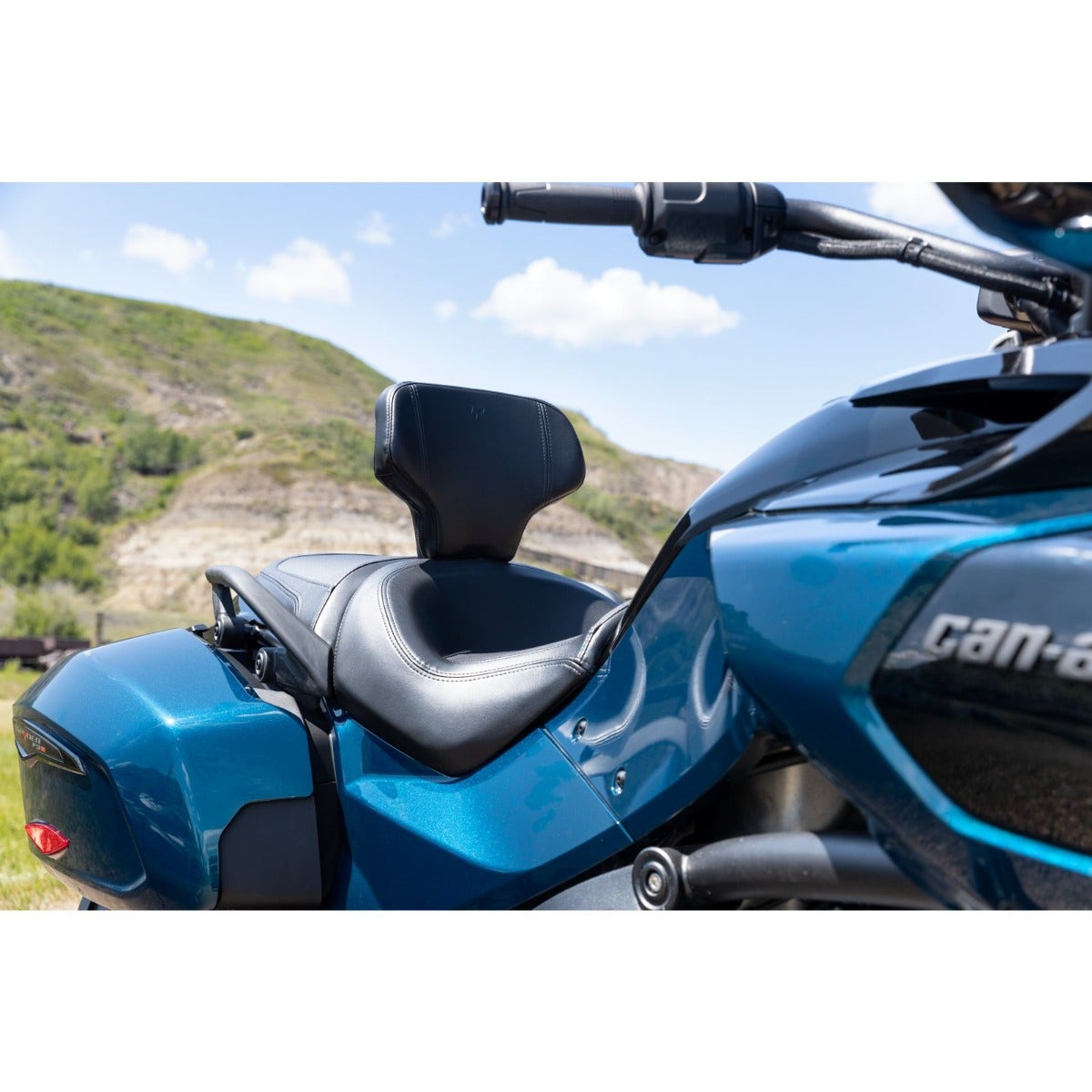 Can-Am Spyder F3 blue three-wheeler with detachable driver backrest installed, side view