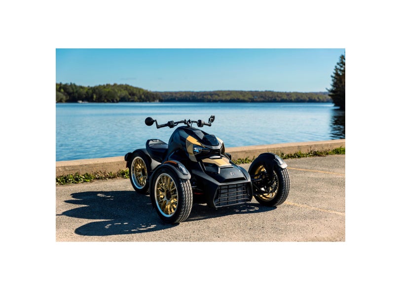 Can-Am Ryker three-wheeler with Circuit Rear Wheel in Liquid Gold parked lakeside