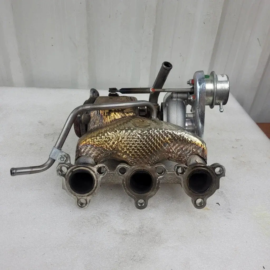 Turbocharger on a white surface with a white background