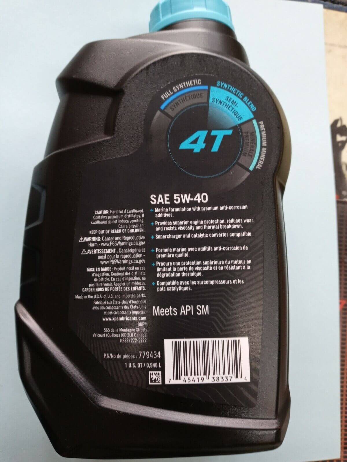 Back view of a motor oil bottle with '4T' and 'SAE 5W-40' text on a light gray background