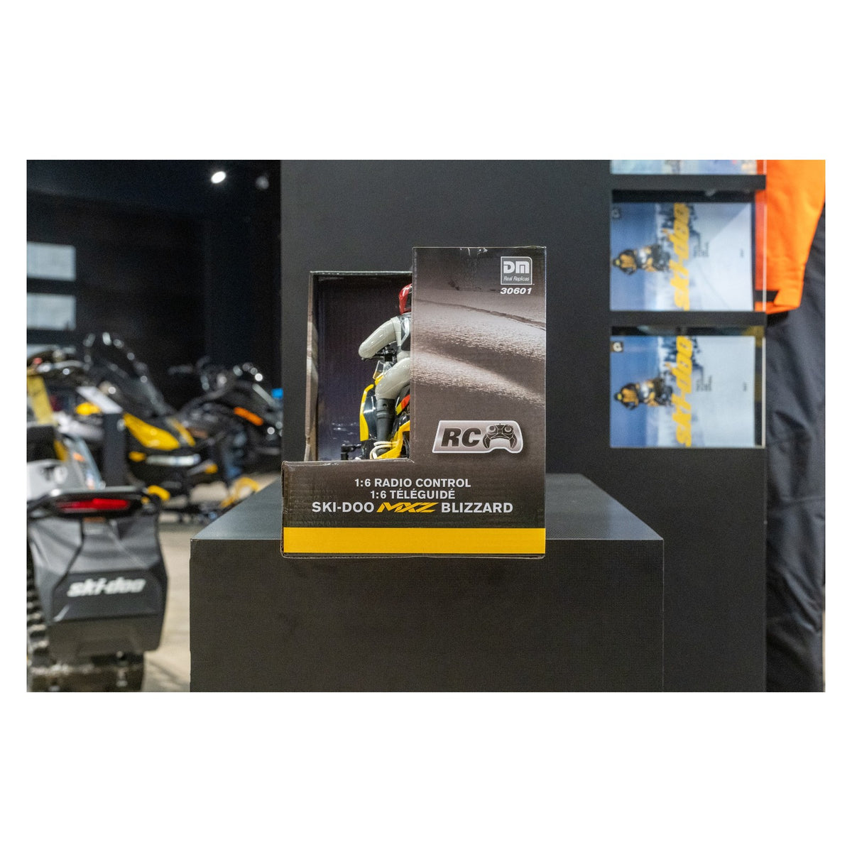 Ski-Doo MXZ Blizzard 1:6 scale RC toy snowmobile retail box on display stand, side view, B107590010
