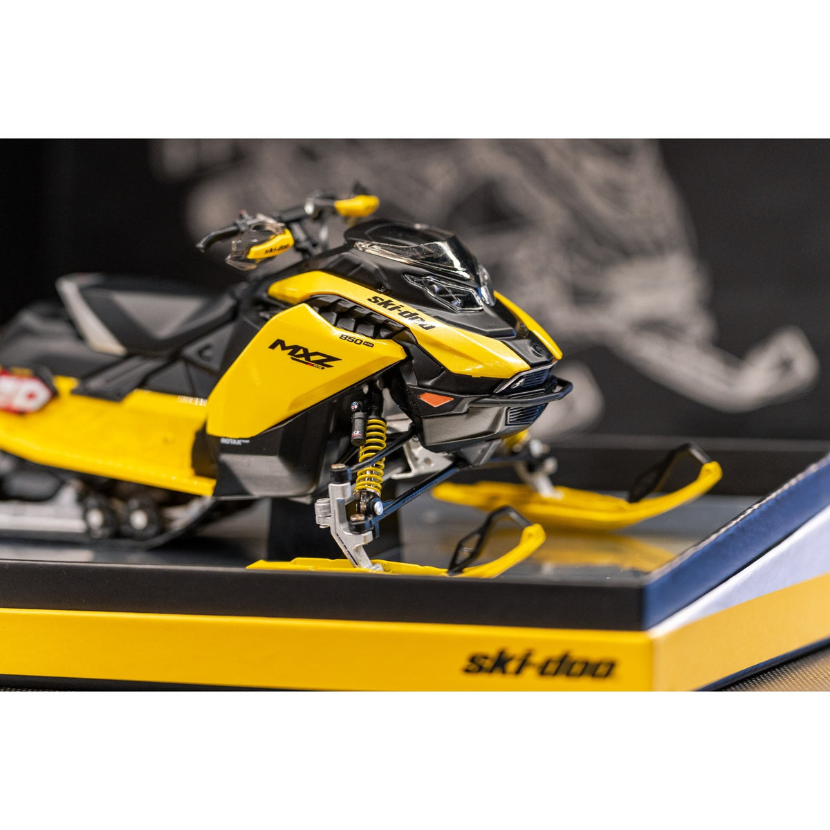 Head-on view of Ski-Doo MXZ XRS diecast showing headlights, shocks and articulated steering