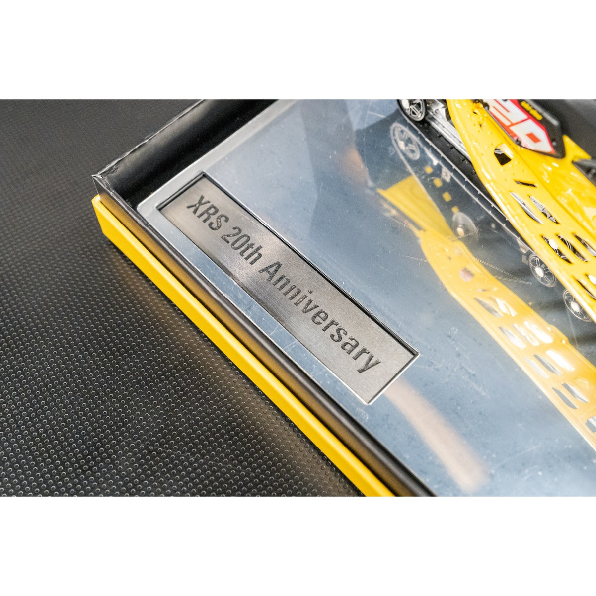 Engraved XRS 20th Anniversary plaque set in the display base