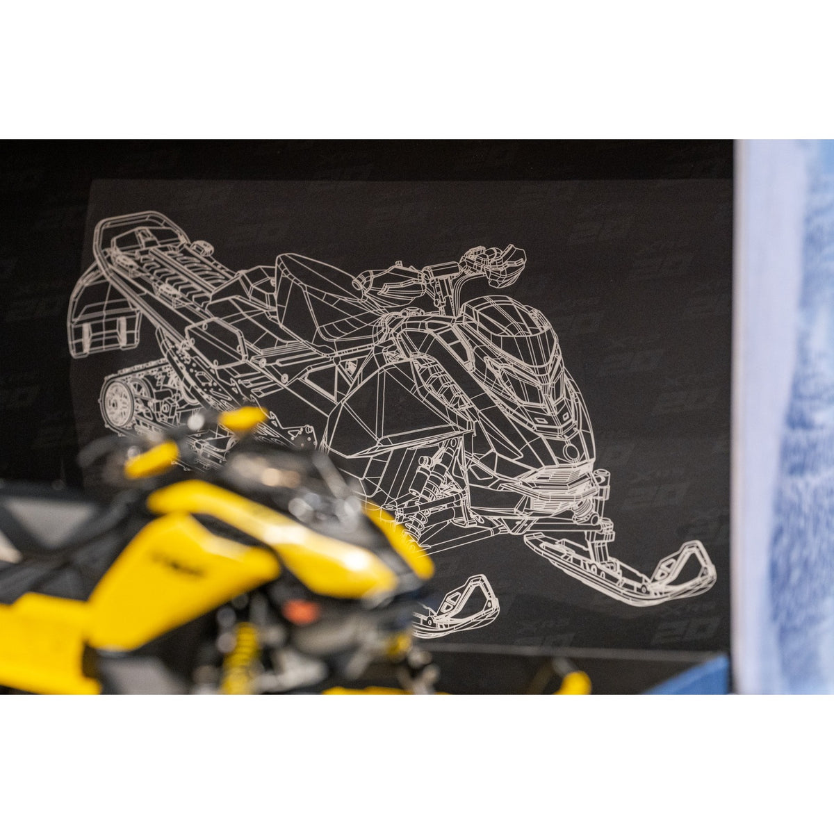 Blueprint-style MXZ XRS line drawing backdrop inside the presentation box