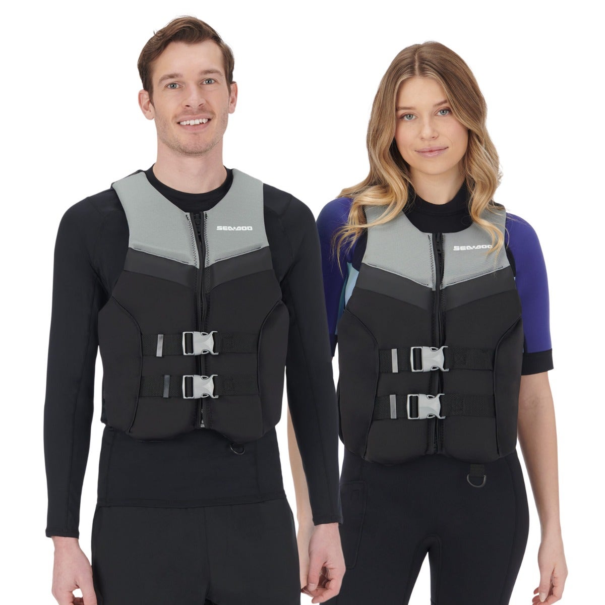 A man and a woman standing next to each other, each wearing a Sea-Doo LifeJacket